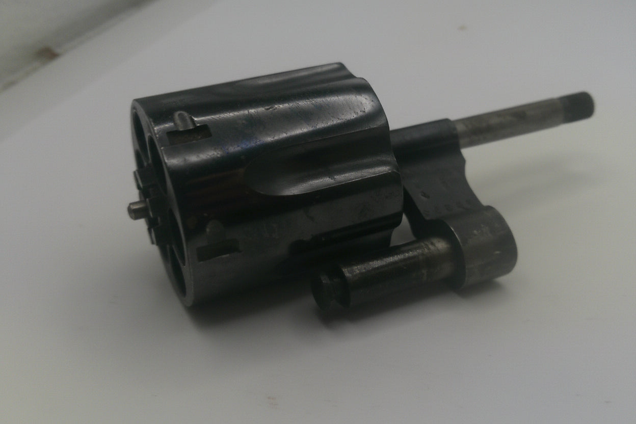Black mechanical component on a white background
