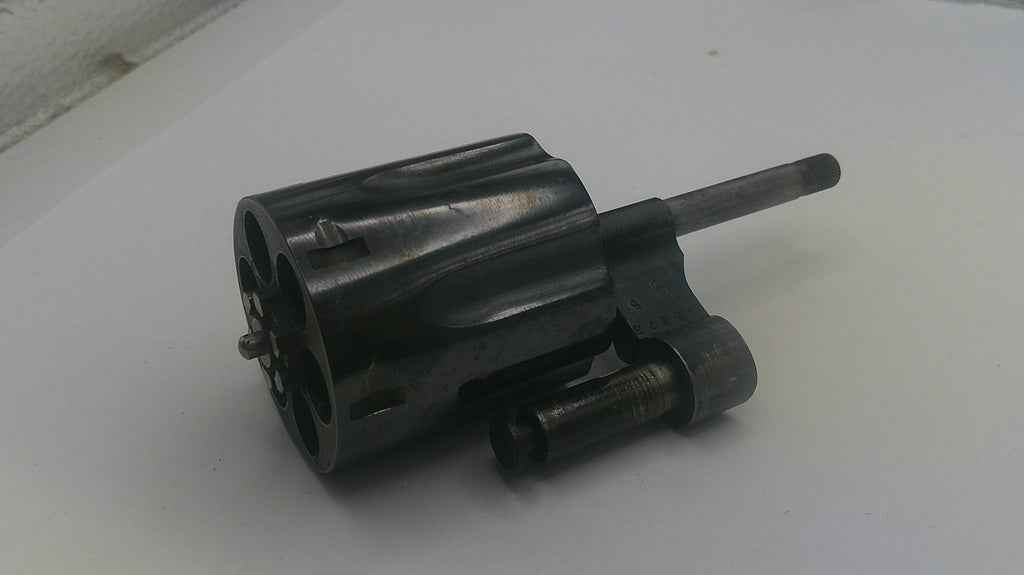Black mechanical component on a white surface