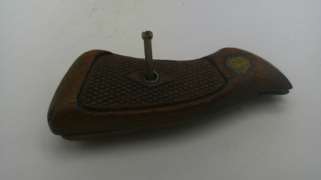 Wooden gun stock with checkered pattern on a white background