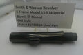 Smith & Wesson revolver barrel with a label on a white background