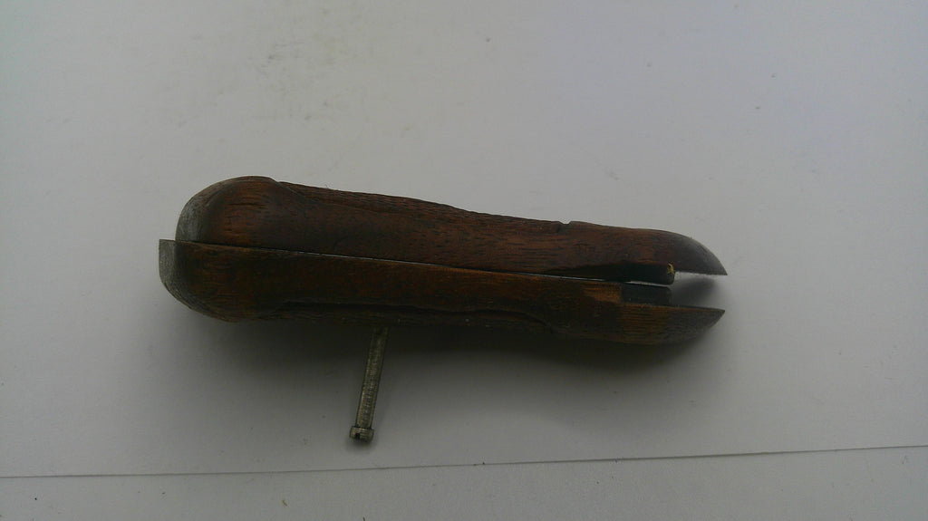 Vintage tool with wooden handle and metal blade on a white background