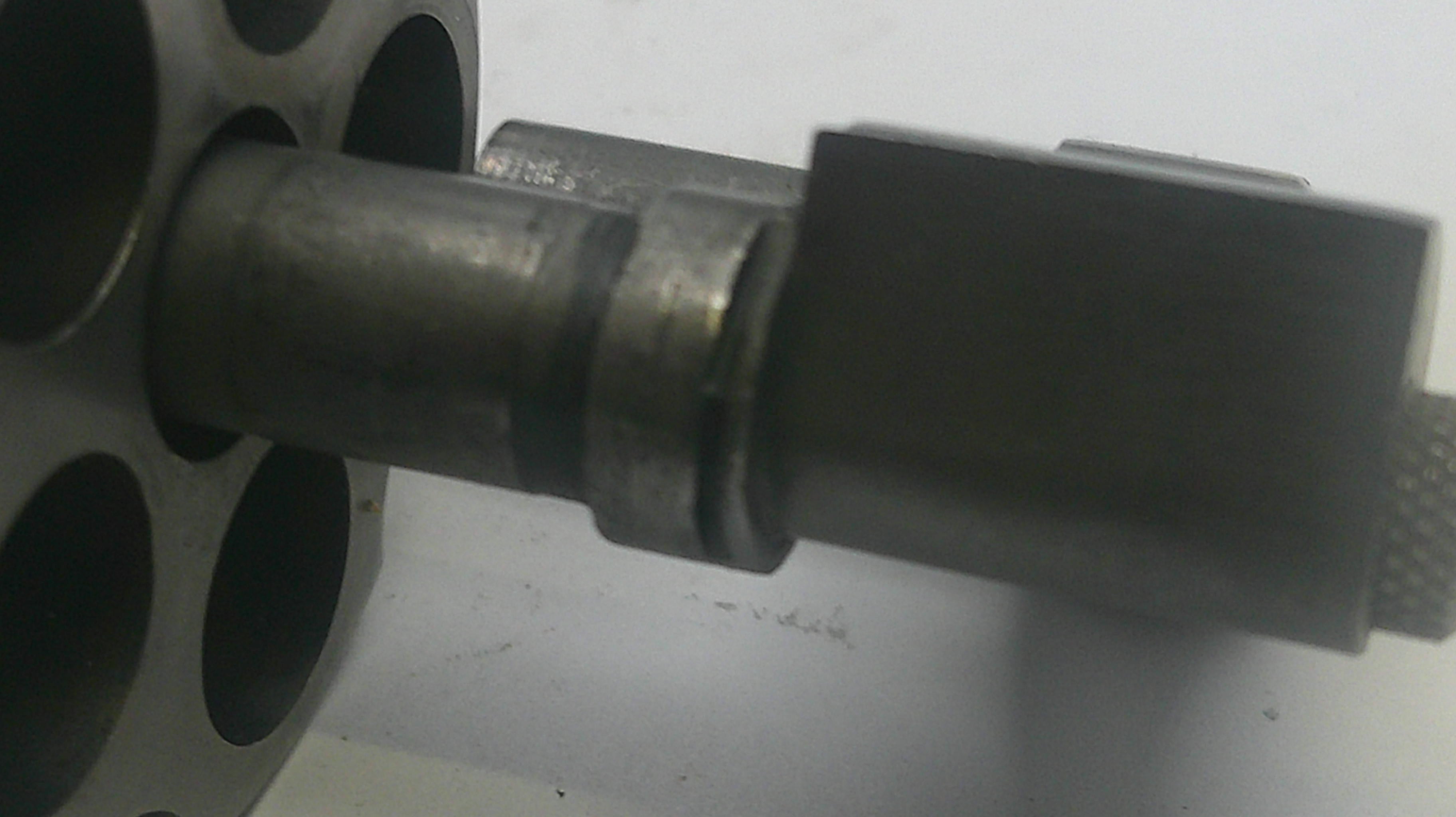 Metal fitting on a white background