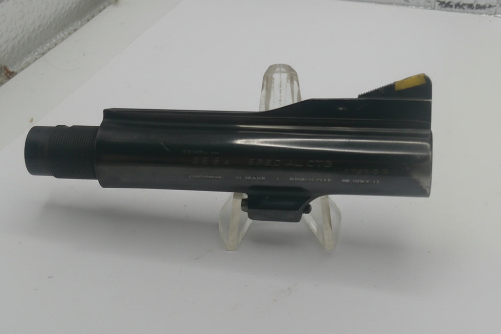 Black metal object on a stand against a white background