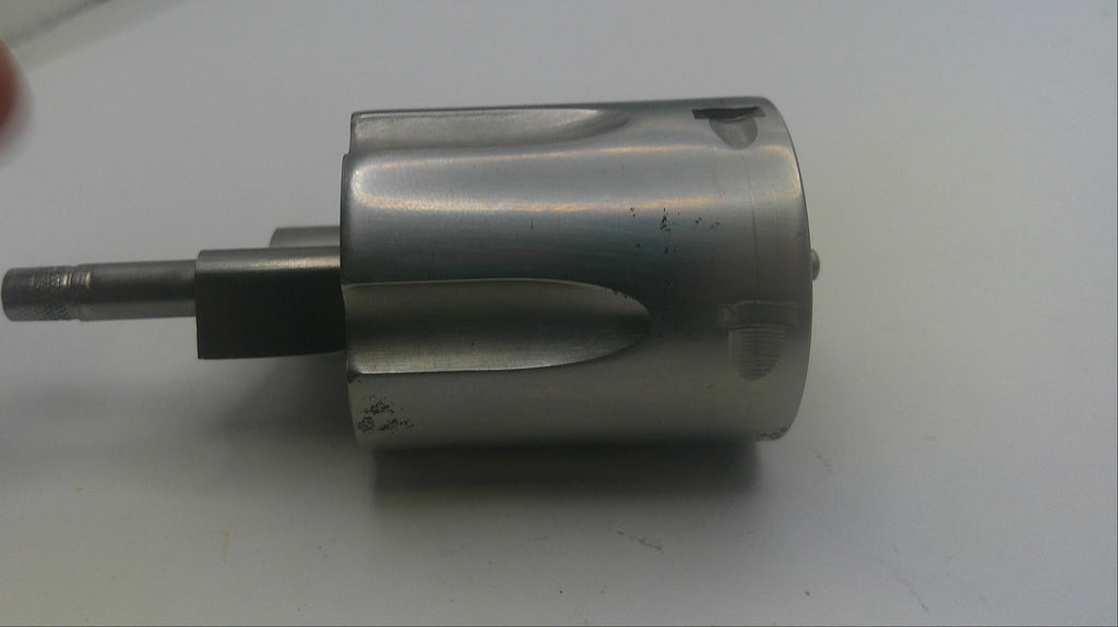 Metal cylindrical component with a shaft on a white background