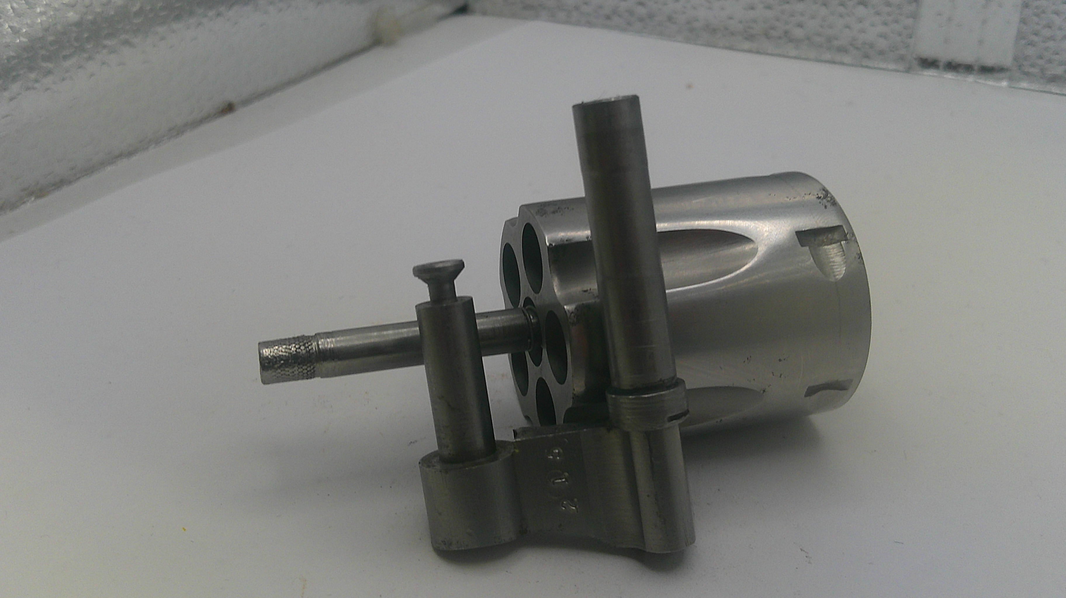 Metal mechanical component on a white surface