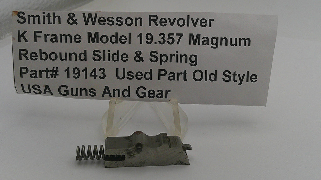 Smith & Wesson revolver part with descriptive label on a white background
