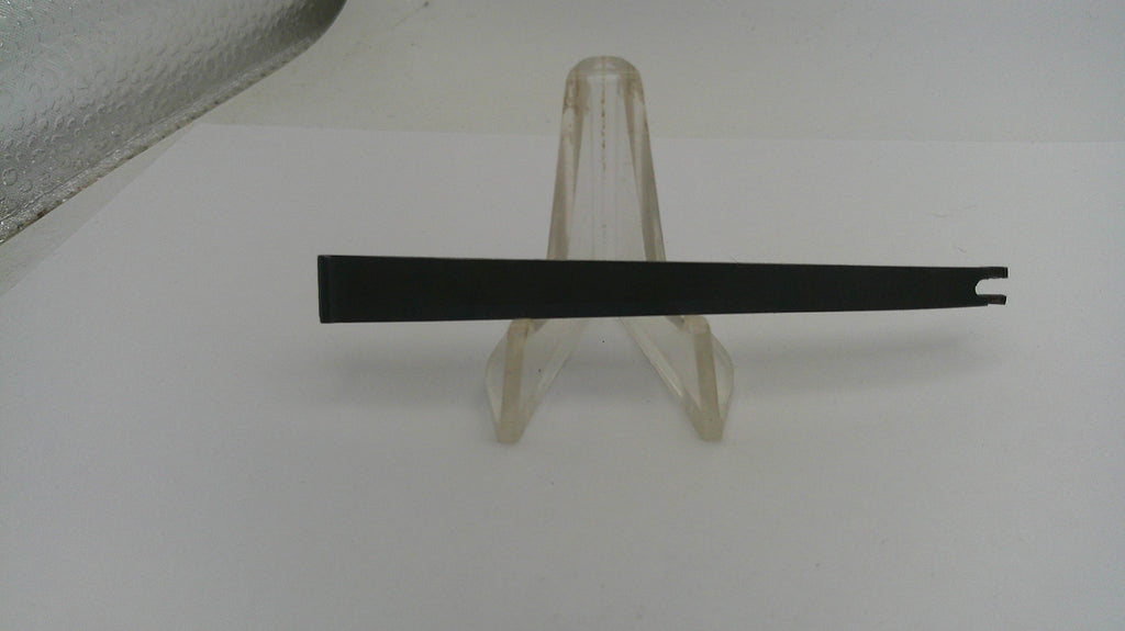 Black metal bar on a clear plastic stand against a white background