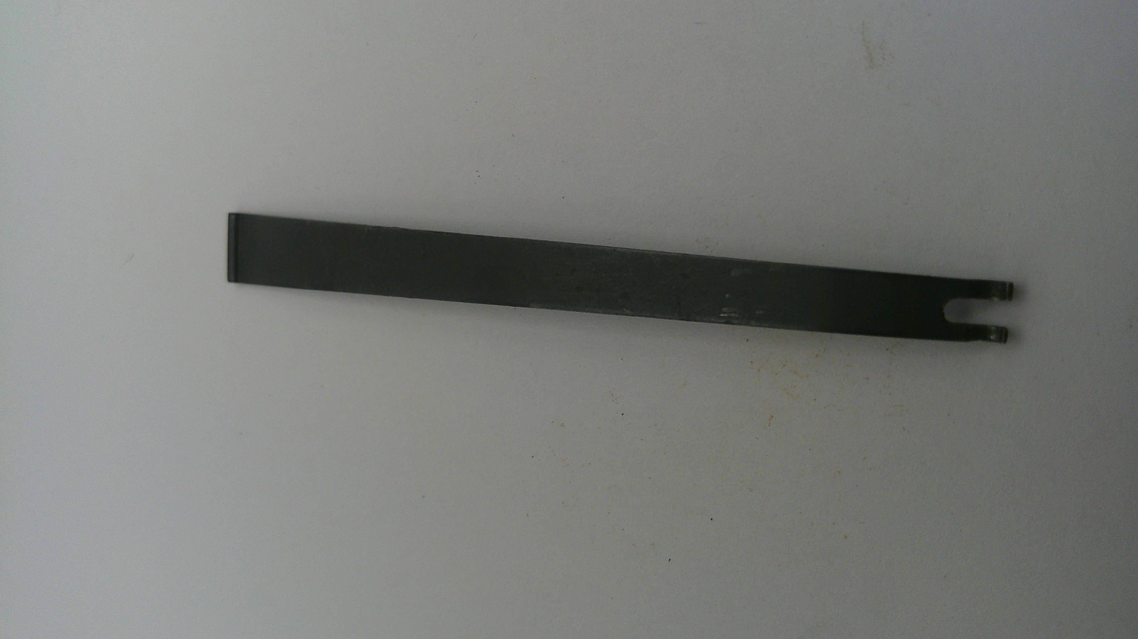 Black metal tool on a white background