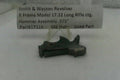 Smith & Wesson revolver hammer assembly on a white background with a label.