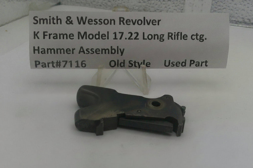 Smith & Wesson revolver hammer assembly on a white background with a label.