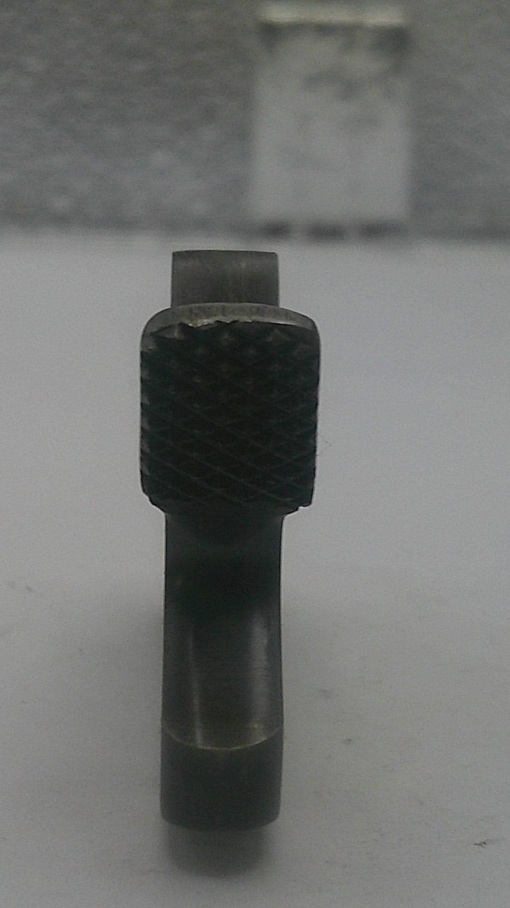 Metal drill bit on a white background