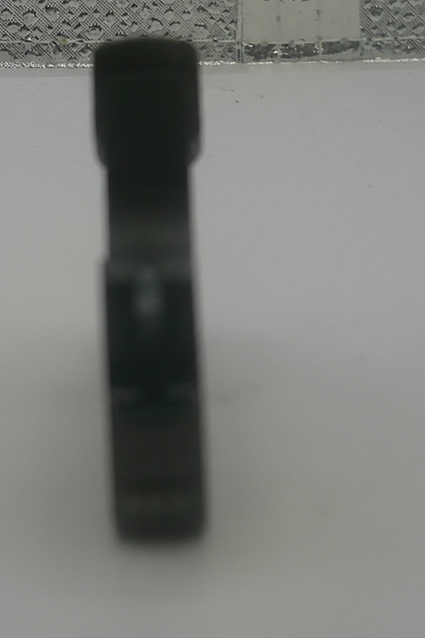 Black object on a textured surface