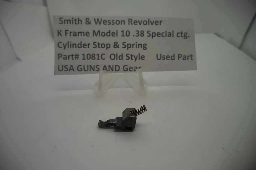 Smith & Wesson revolver cylinder stop and spring on a white background with a label.
