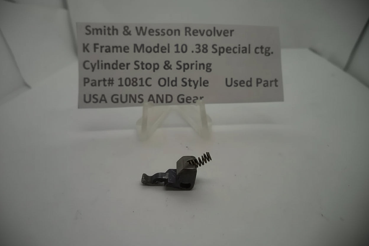 Smith & Wesson revolver cylinder stop and spring on a white background with a label.