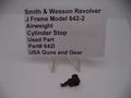 Smith & Wesson J Frame Model 642-2 Airweight Cylinder Stop, used part, displayed on a white surface with a sign detailing the product information.