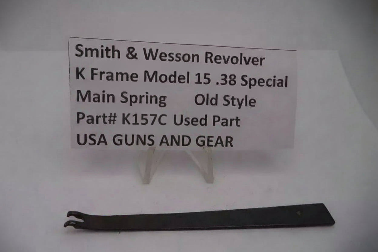 Smith & Wesson revolver main spring on a white background with a label.