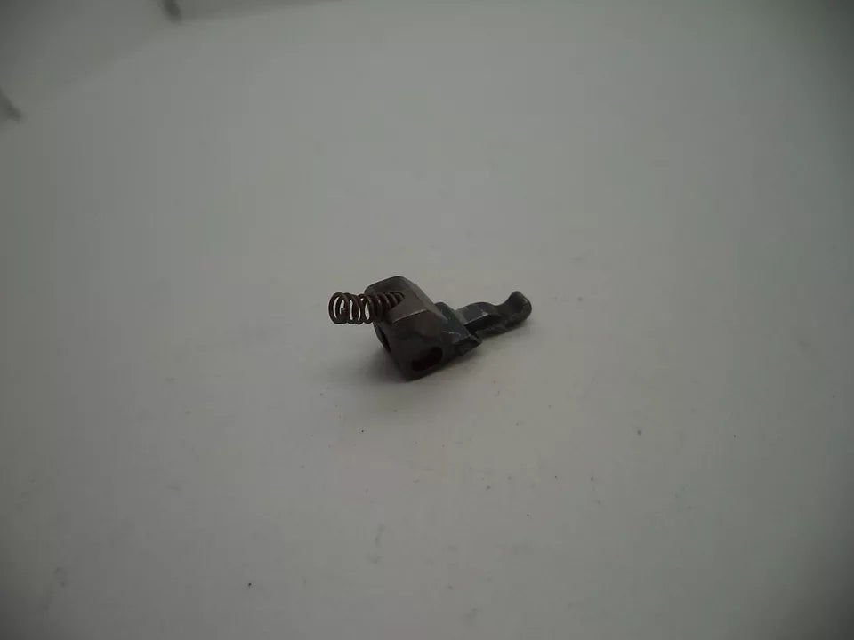 Small metal spring-loaded component on a white background