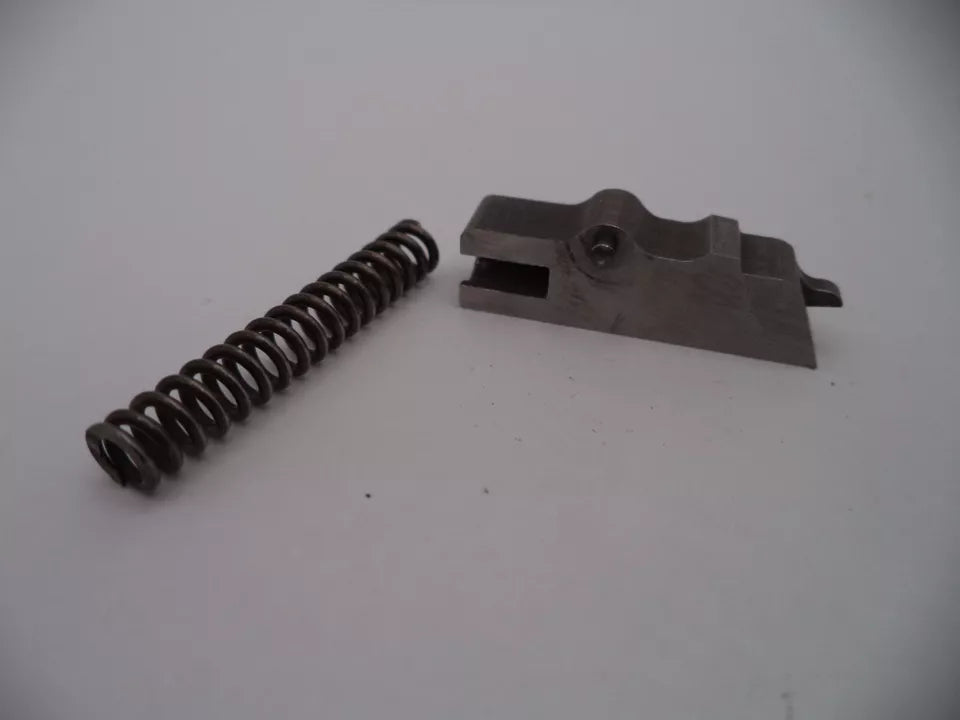 Metal spring and metal bracket on a white background