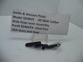 Smith & Wesson Pistol Model SD40 VE Slide Stop Lever Assembly for .40 S&W displayed on a white background with a descriptive label in front.