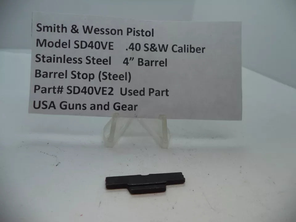 Smith & Wesson Pistol Model SD40 VE Barrel Stop, stainless steel, 4 inch barrel, .40 S&W caliber, part number SD40VE2, used part, displayed on a white surface with a label providing details.