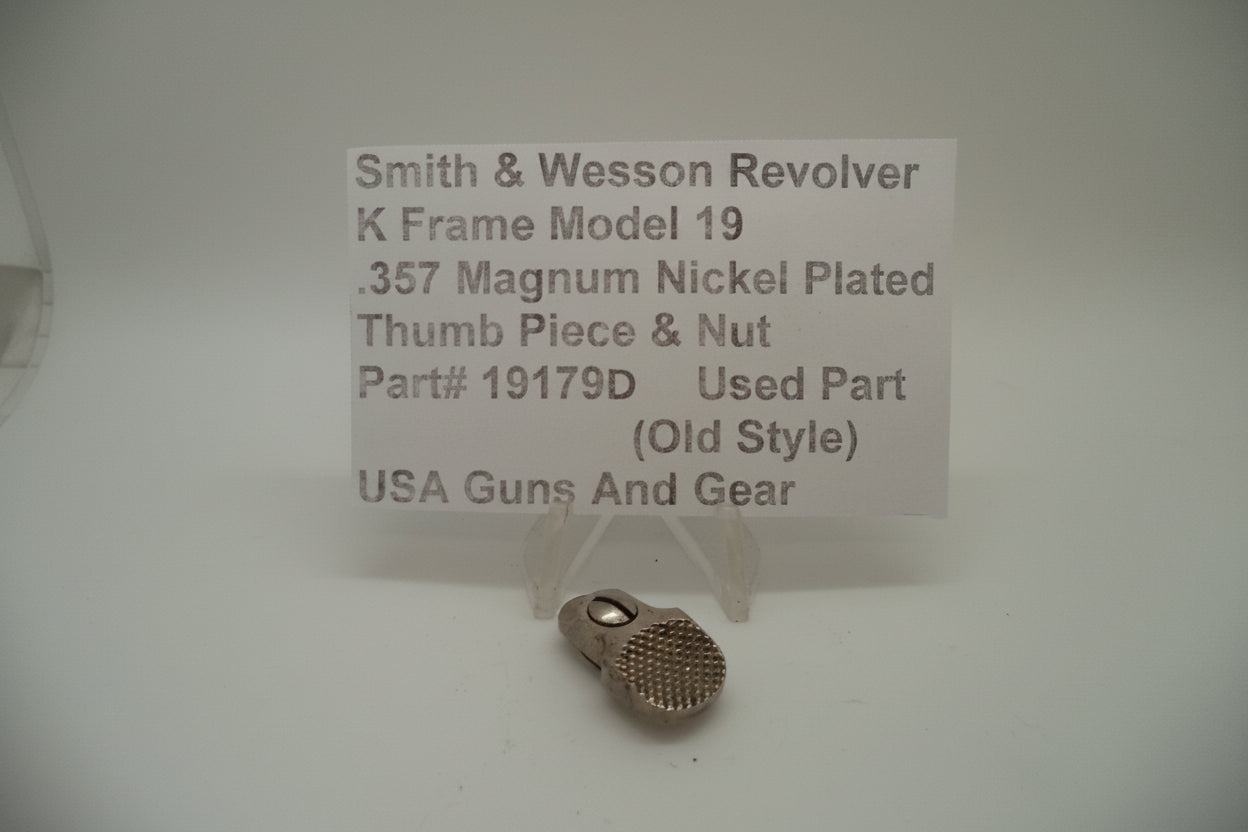 Smith & Wesson K Frame Model 19 revolver part, showing the thumb piece and nut used for ejecting spent cartridges. The part is nickel-plated and shows signs of wear.