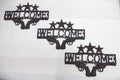 Western Dual Revolver Welcome Sign 3-Pack - Rustic Gun Decor 11.75"x19.5"