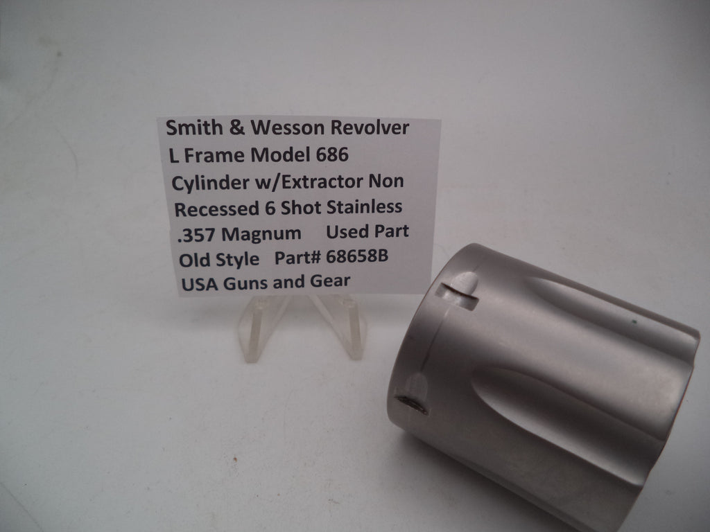 A Smith & Wesson revolver L Frame Model 686 cylinder with extractor, non-recessed .357 Magnum used part, displayed on a white background.