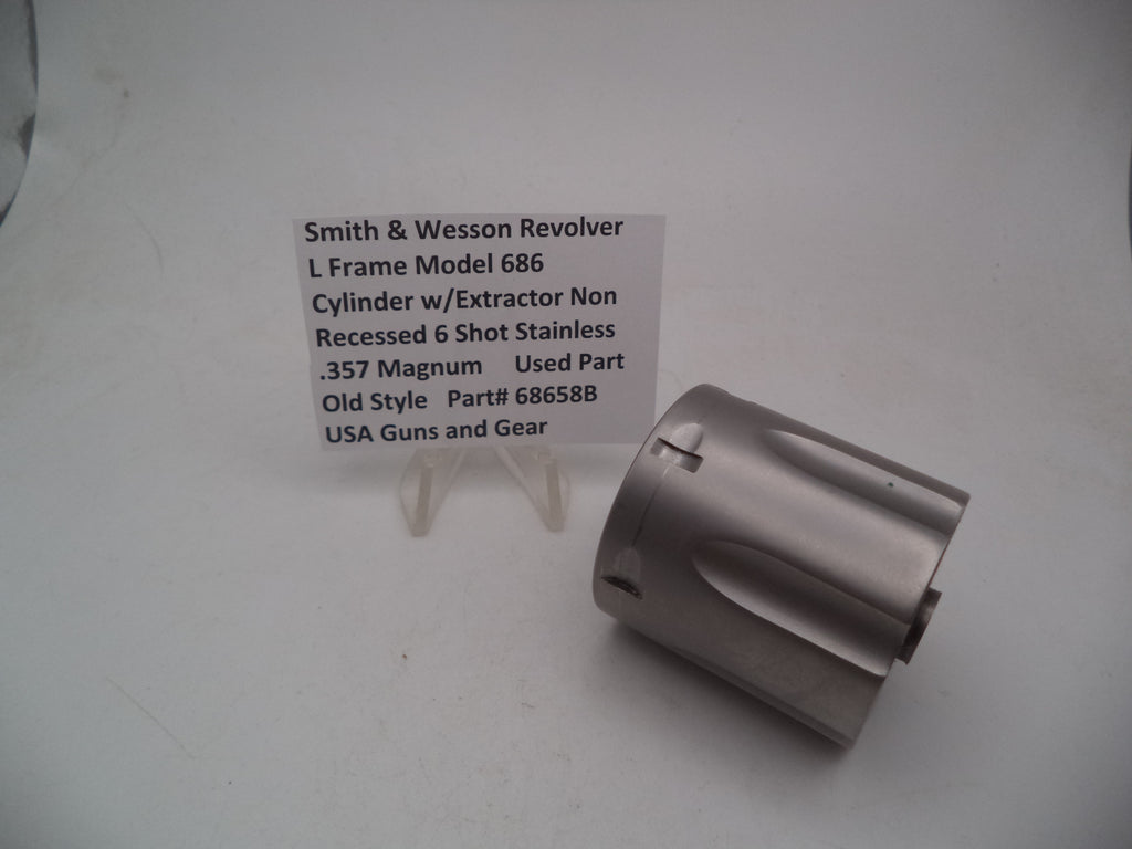 A Smith & Wesson revolver L Frame Model 686 cylinder with extractor, non-recessed .357 Magnum used part, displayed on a white background.
