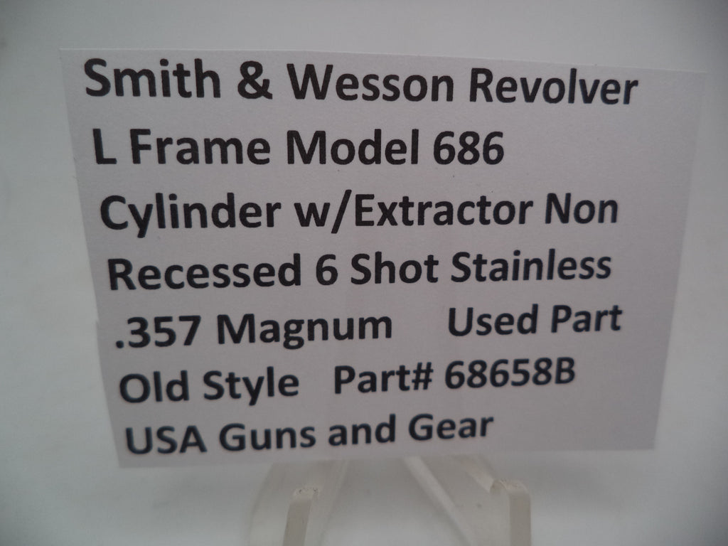A Smith & Wesson revolver L Frame Model 686 cylinder with extractor, non-recessed .357 Magnum used part, displayed on a white background.