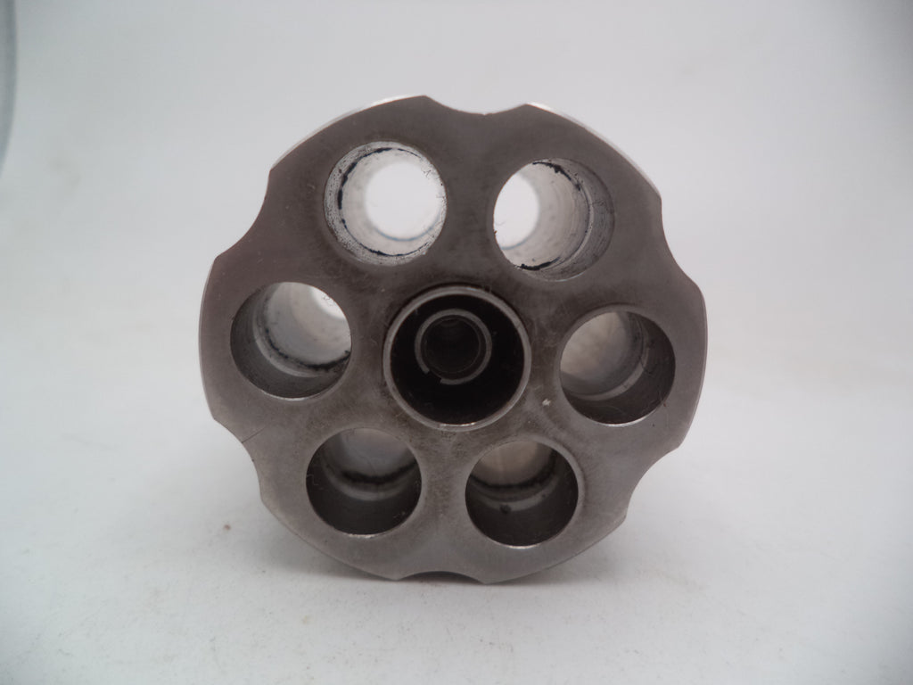 A Smith & Wesson revolver L Frame Model 686 cylinder with extractor, non-recessed .357 Magnum used part, displayed on a white background.