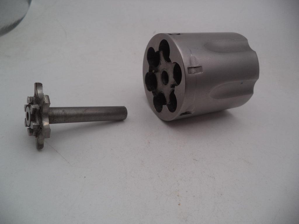 A Smith & Wesson revolver L Frame Model 686 cylinder with extractor, non-recessed .357 Magnum used part, displayed on a white background.