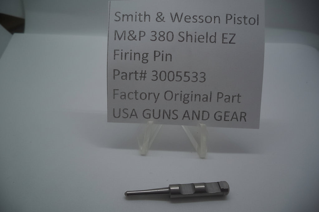 A metal firing pin for a Smith & Wesson M&P 380 Shield EZ pistol, displayed on a white background with a label indicating the part number and manufacturer.