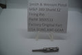 A metal firing pin for a Smith & Wesson M&P 380 Shield EZ pistol, displayed on a white background with a label indicating the part number and manufacturer.