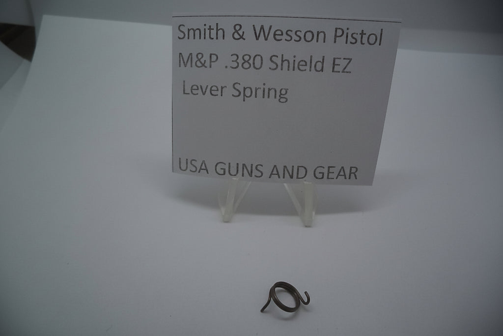 The image shows a Smith & Wesson M&P 380 Shield EZ Lever Spring, part number 3005518, displayed on a white background. The price tag on the spring indicates that it is a new part, designed for USA guns and gear.