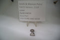 The image shows a metal lever labeled as Smith & Wesson SW 22 Victory, .22LR, with a price tag of $4.