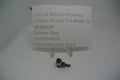 A metal cylinder stop for a Smith & Wesson revolver, displayed on a white background with a label providing product information.