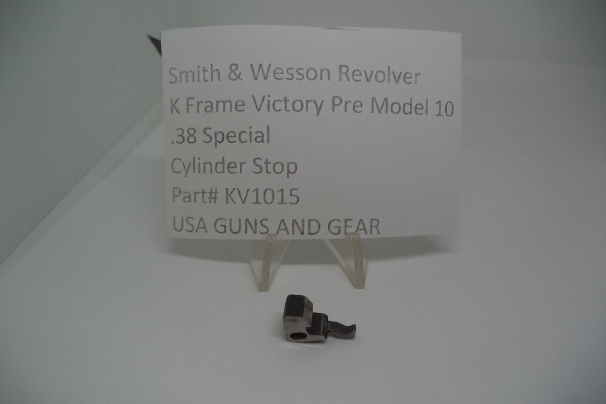 A metal cylinder stop for a Smith & Wesson revolver, displayed on a white background with a label providing product information.