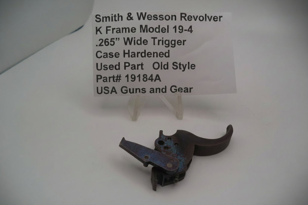 Smith & Wesson K Frame Model 19-4 Trigger .265 inch Wide Case Hardened used part displayed on a white background.