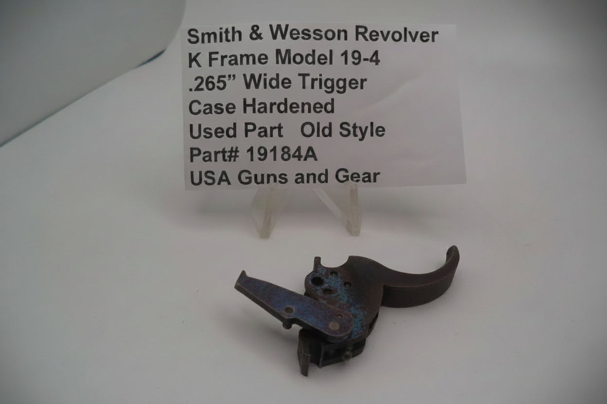 Smith & Wesson K Frame Model 19-4 Trigger .265 inch Wide Case Hardened used part displayed on a white background.