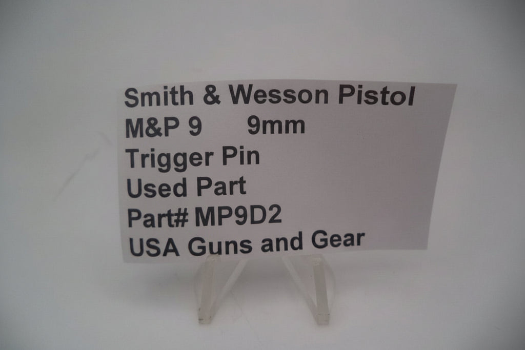 Card with information about a used Smith & Wesson pistol trigger pin on a white background