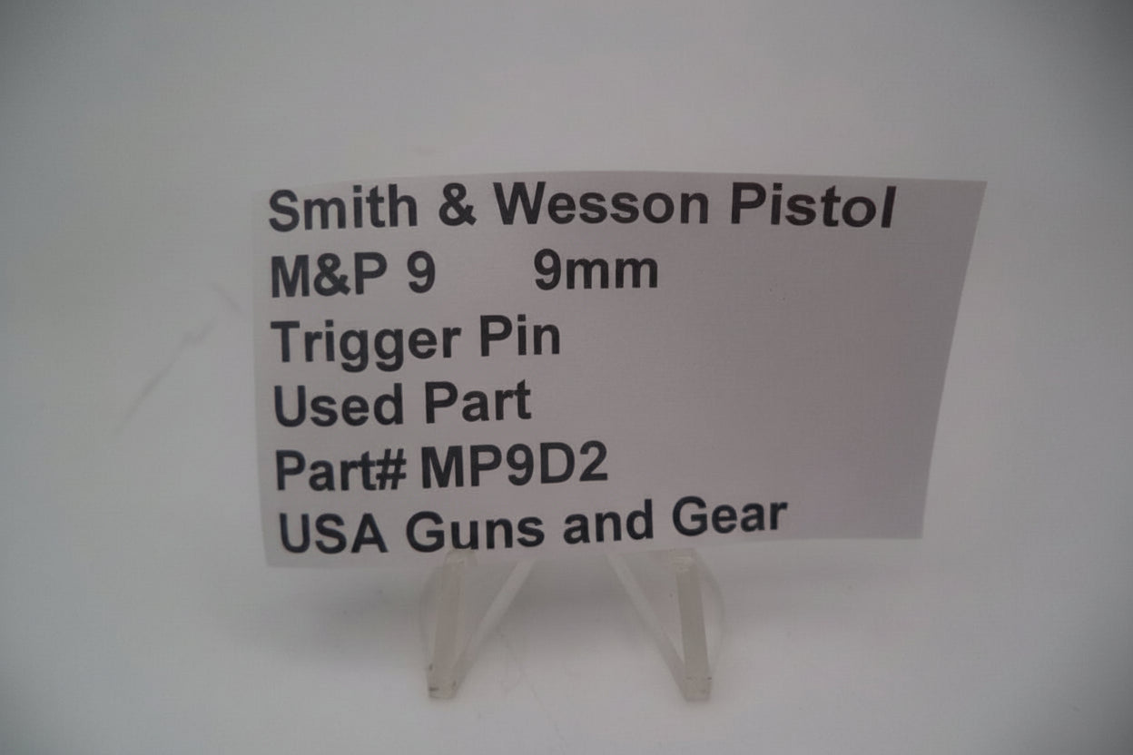 Card with information about a used Smith & Wesson pistol trigger pin on a white background