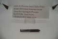 The image shows a Smith & Wesson Model 659 stainless steel draw bar spring and plunger, used parts for an auto pistol.