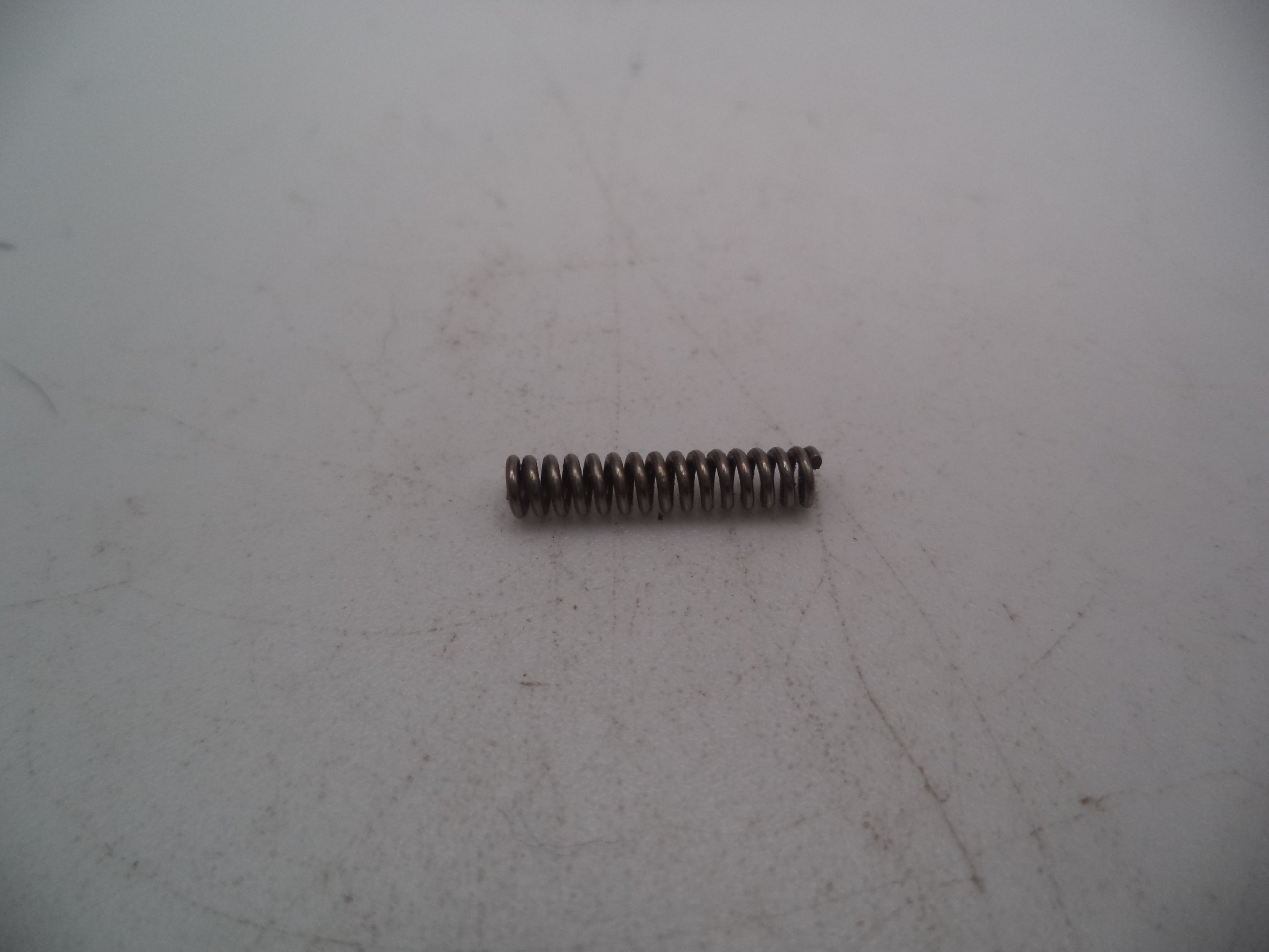 690415 Smith & Wesson Pistol Model 6904 9mm Ejector Depressor Spring Used
