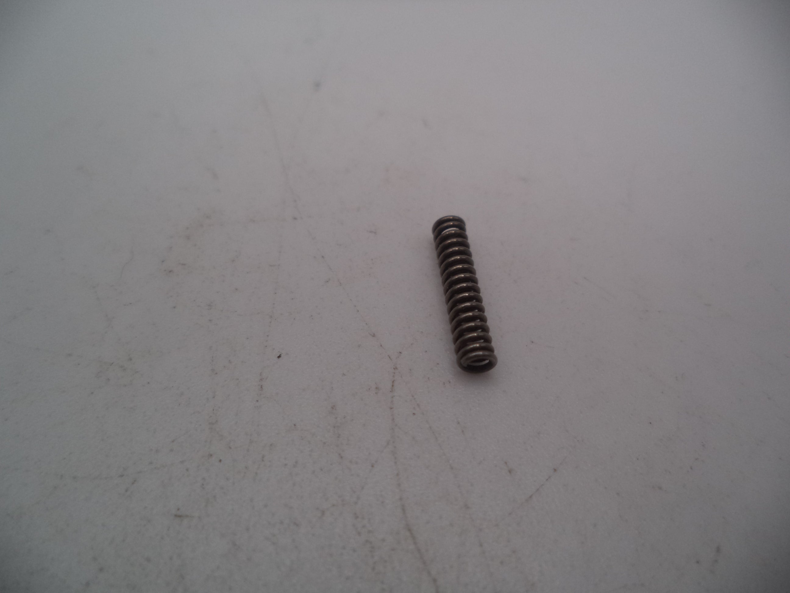 690415 Smith & Wesson Pistol Model 6904 9mm Ejector Depressor Spring Used