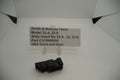 Smith & Wesson Pistol Model 22A, 22S Slide Insert displayed on a white stand with a label detailing product information.