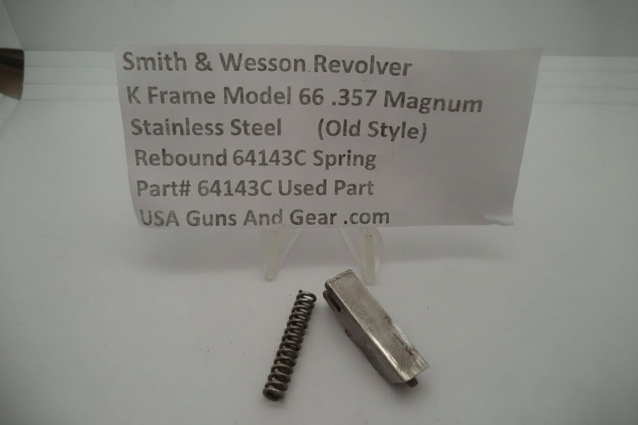 Smith & Wesson revolver parts including a slide and spring on a white background with a descriptive card.