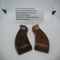 Two wooden revolver grips with metal screws, labeled as 'Smith & Wesson Revolver & K Frame Round Butt Only Vintage Wood Service Grips' with a price tag in the background.