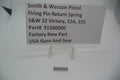 Packaging label for Smith & Wesson firing pin return spring, showing the part number and model compatibility, with a price tag of $6.99.