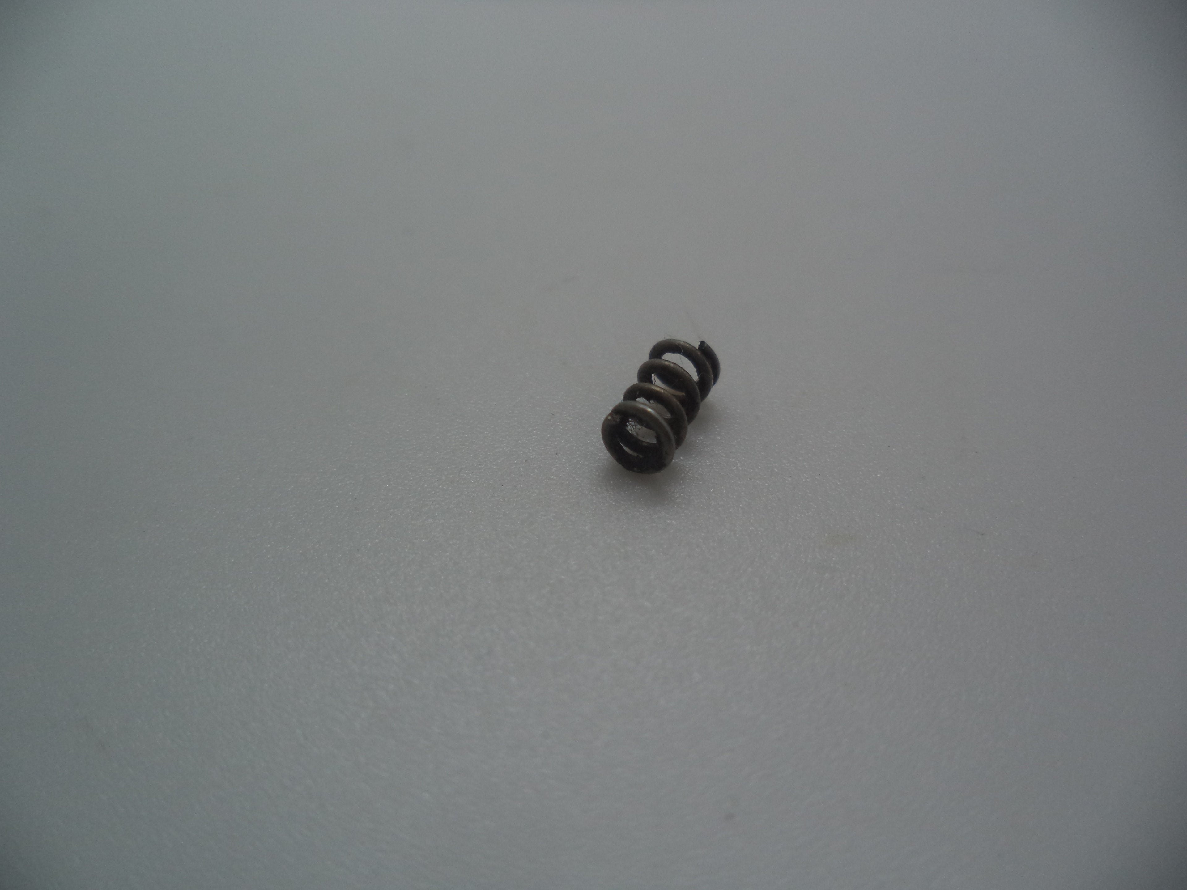 2210 North American Arms Mini Revolver 5 Shot Trigger Spring (Used Part) .22 Long Rifle