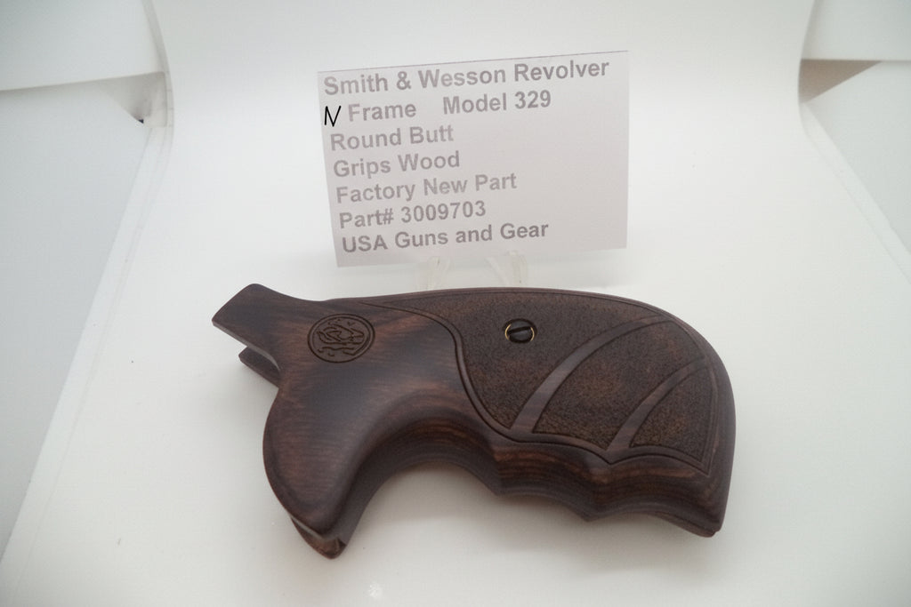 Smith & Wesson N Frame revolver wood grip round butt factory part displayed on a white surface with a label indicating the model number and price.